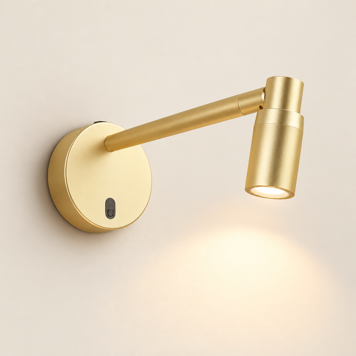 Galerie Wireless Picture Spotlight in gold, shown as a single fixture on a warm ivory studio background.