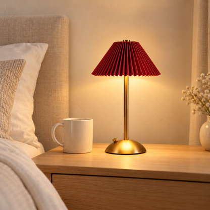 Poppy 30 cm red rechargeable table lamp beside a 9 cm ivory mug